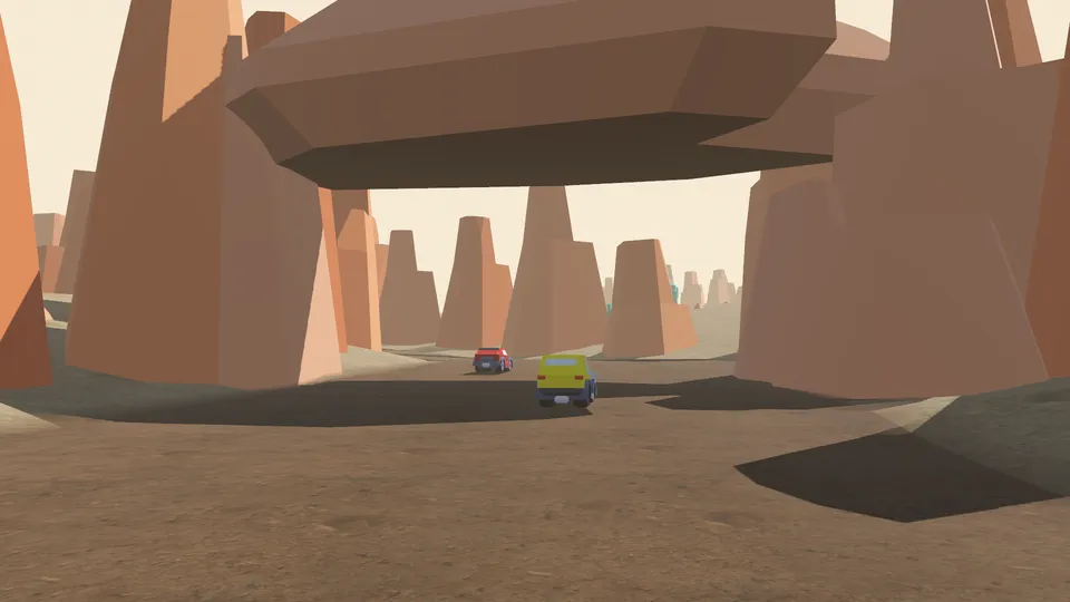 Two cars driving under a huge natural rock arch in a desert canyon